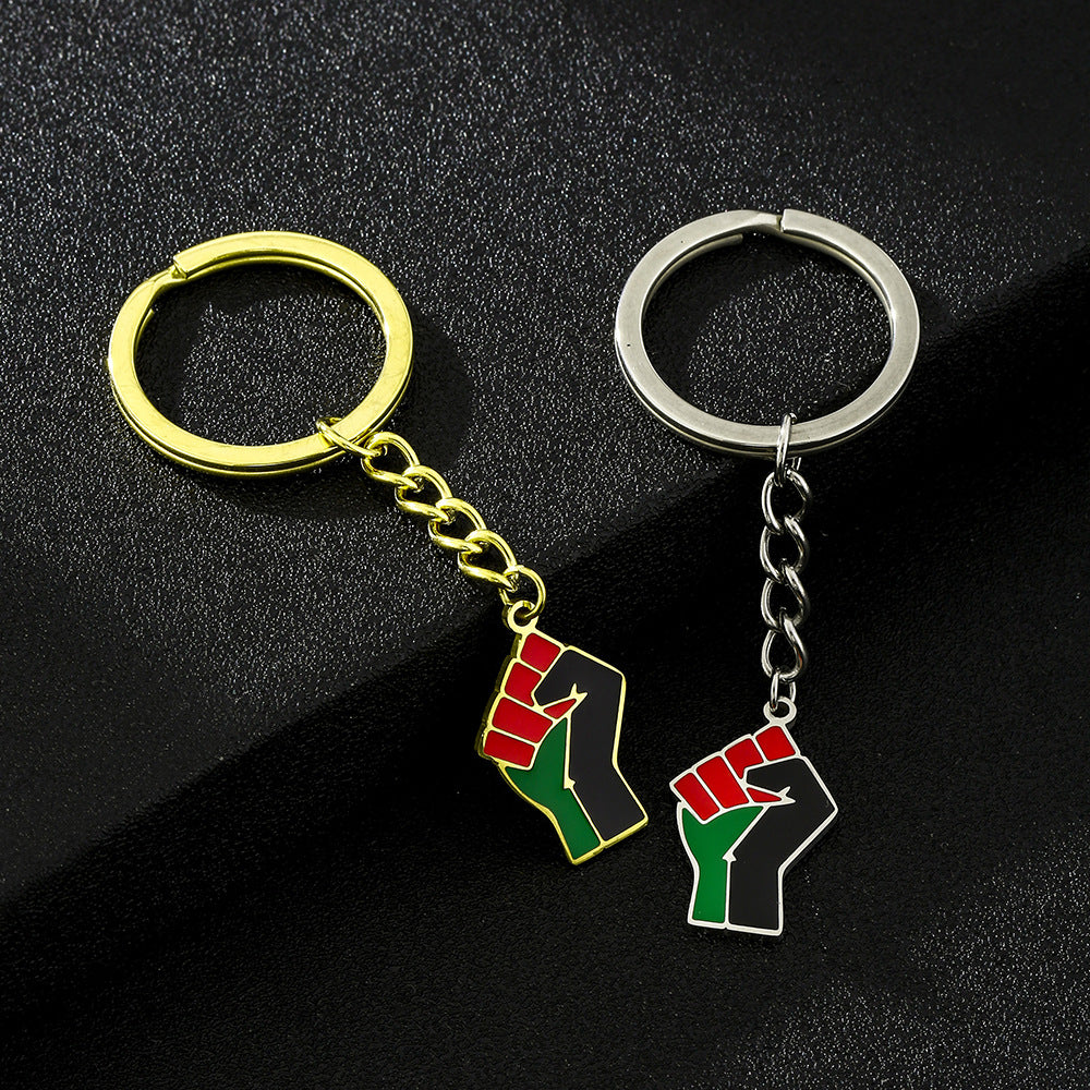 Accessorio pendente portachiavi in ​​acciaio al titanio a forma di pugno in stile etnico per uomo e donna