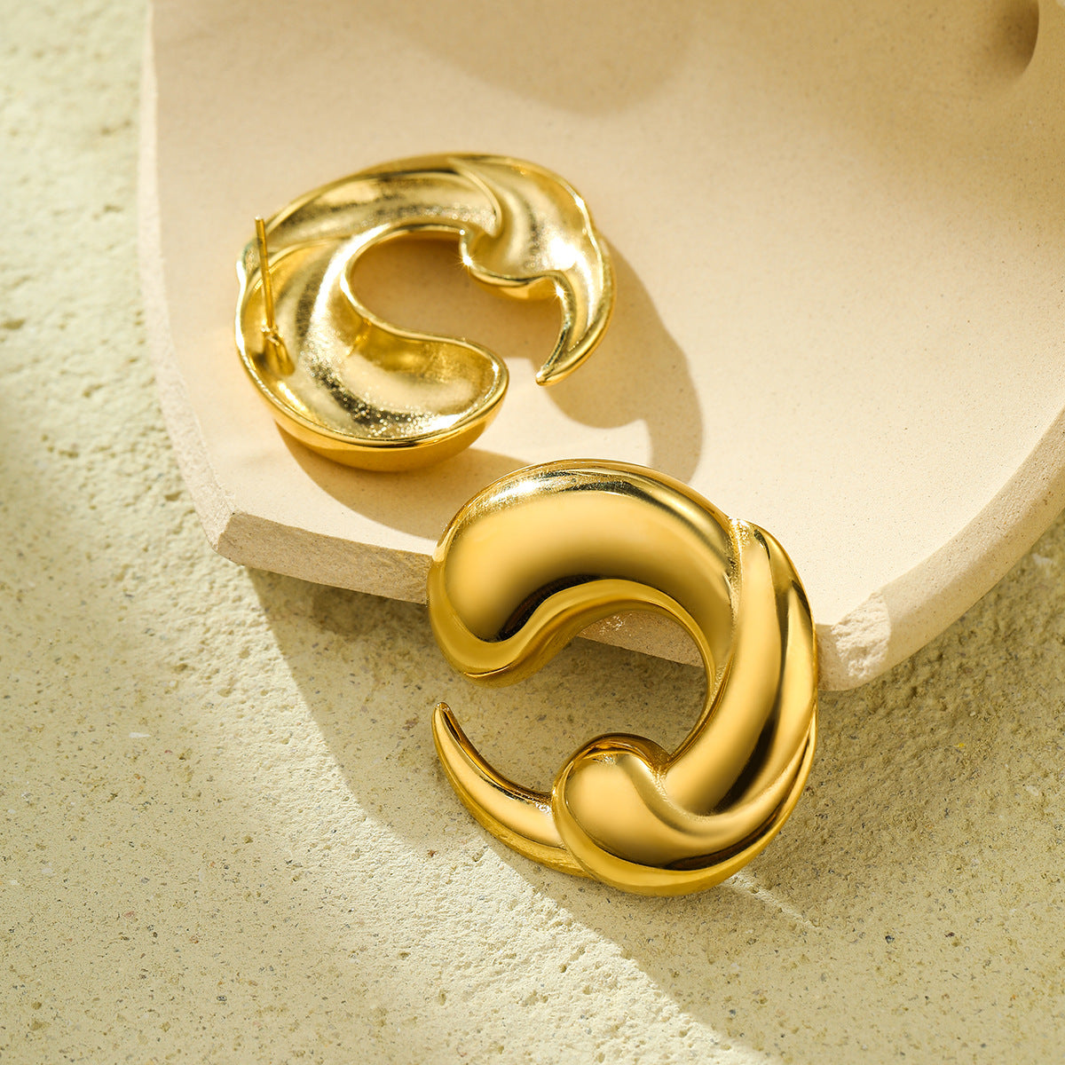 Fashionable Dripping Water Drop Shaped Stainless Steel Electroplated Earrings for Women with Hollow and Twisted Design
