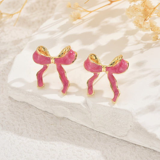 Encantadores aretes de esmalte en forma de lazo para mujer, de aleación de zinc con diseño minimalista y elegante.