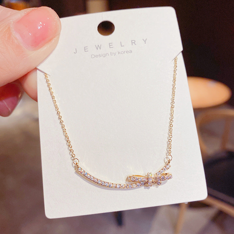 Minimalist Bow-Shaped Titanium Steel Necklace for Women with Alloy Pendant and Cross Chain Design