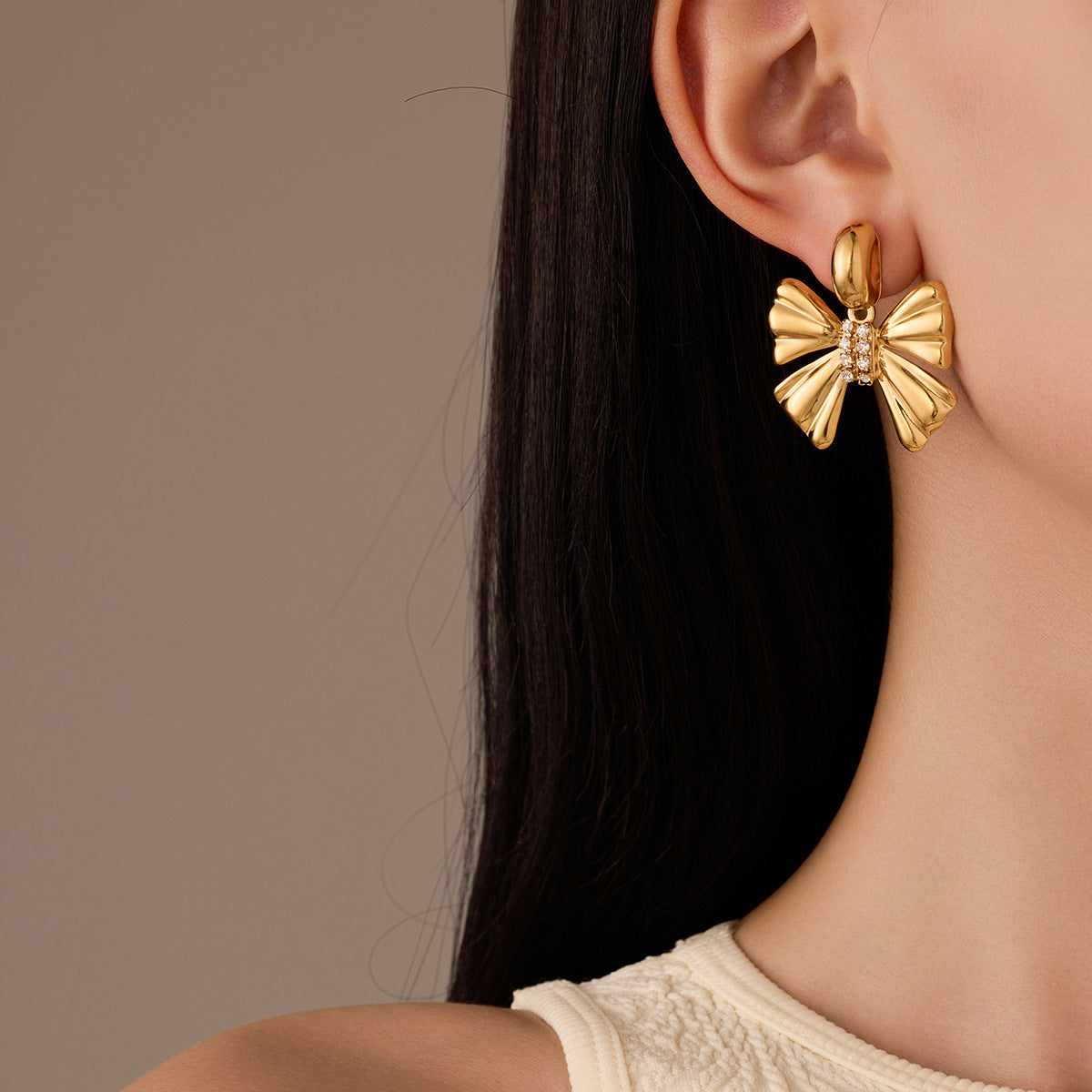 Orecchini da donna alla moda in acciaio inossidabile a forma di fiocco con placcatura in oro 18 carati