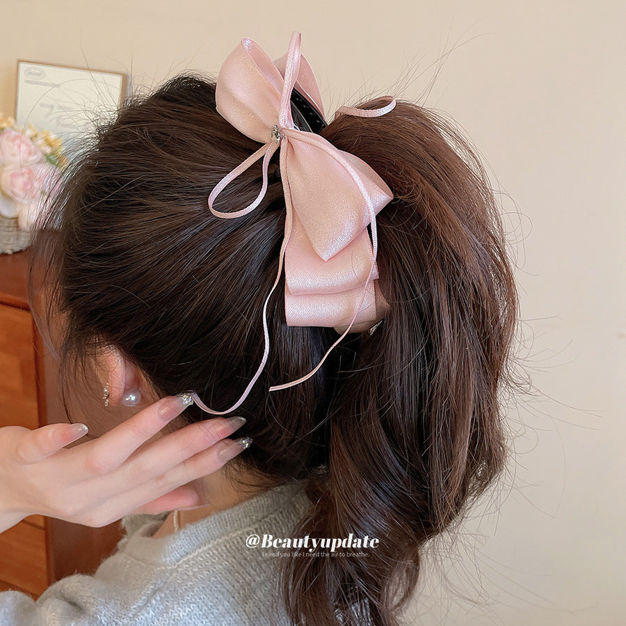 Elegante fermaglio per capelli da donna a forma di fiocco e stella con intarsio di zirconi su base in tessuto, a banana, per la parte posteriore della testa