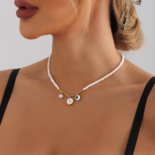 Bohemian White Beaded Necklace with Alloy Letter Eye Pendant on Clavicle Chain