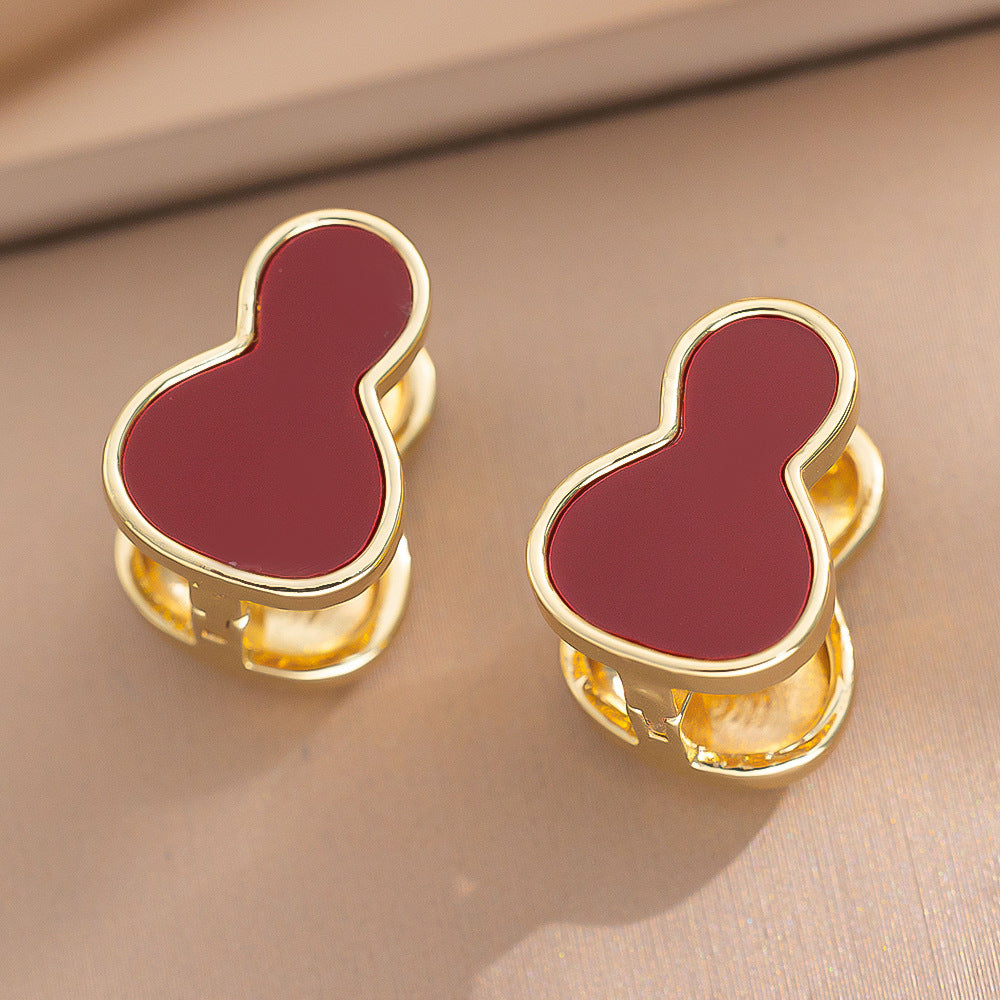 Orecchini a perno Saturno minimalisti color oro in ottone con zirconi per donna