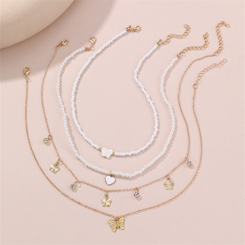 Bonito collar con dije de aleación esmaltado en forma de corazón para niños con cadena de eslabones torcidos