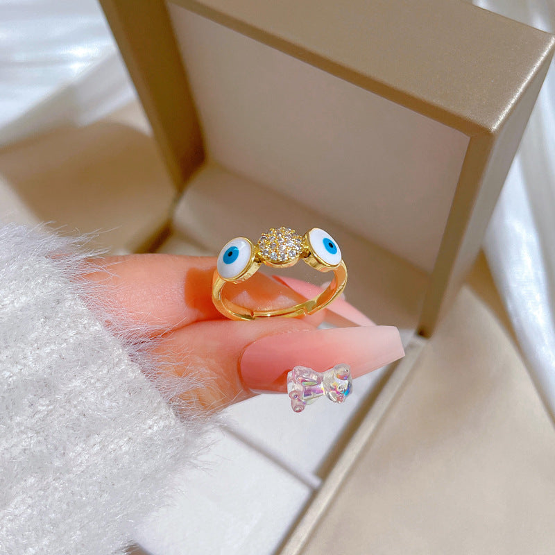 Anello da donna in ottone placcato oro con zirconi micro-incastonati a forma di occhio minimalista