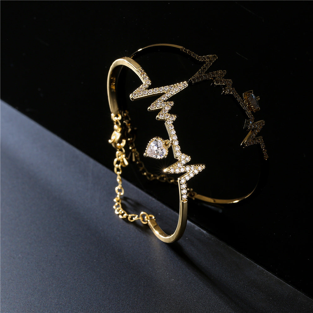 Gold Plated Brass Heartbeat Bracelet with Cubic Zirconia Inlay