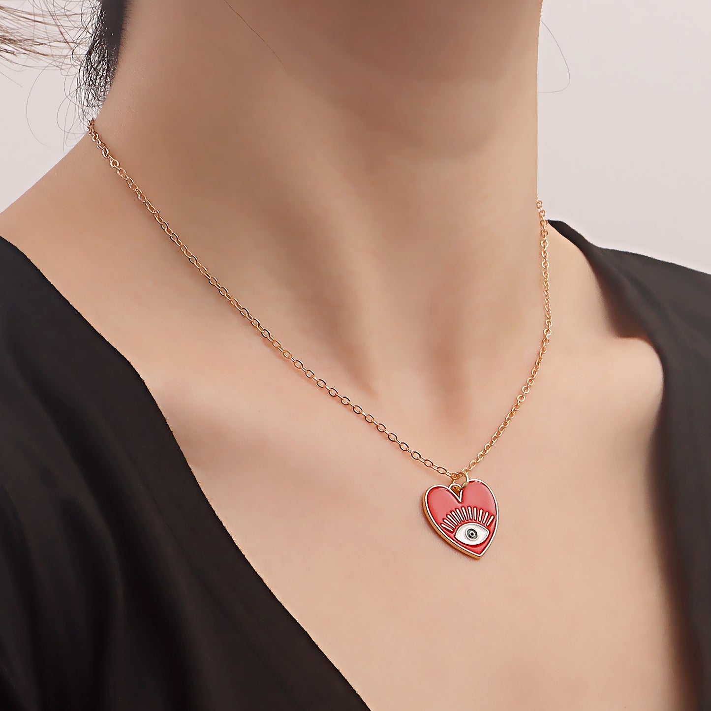 Minimalist Evil Eye Pendant Necklace for Women with Alloy Heart Charm and Geometric Design on Clavicle Chain
