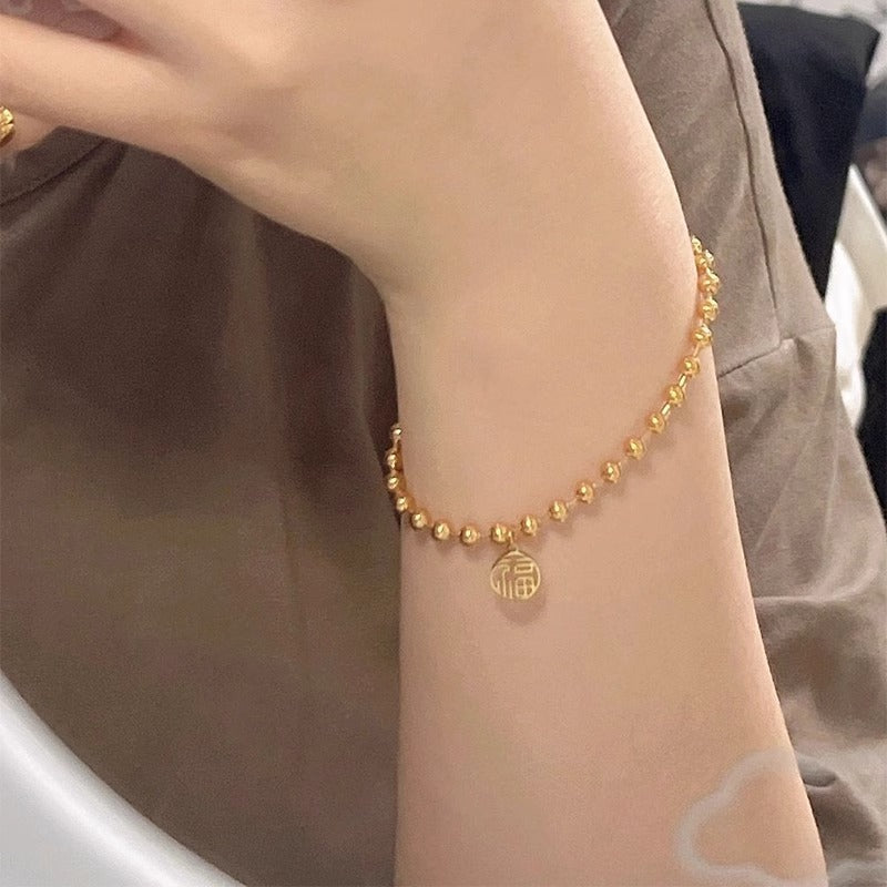 Original Design Leaf-Shaped Titanium Steel Bracelet with 18K Gold Plating for Women, Hypoallergenic Round Bead Wristband