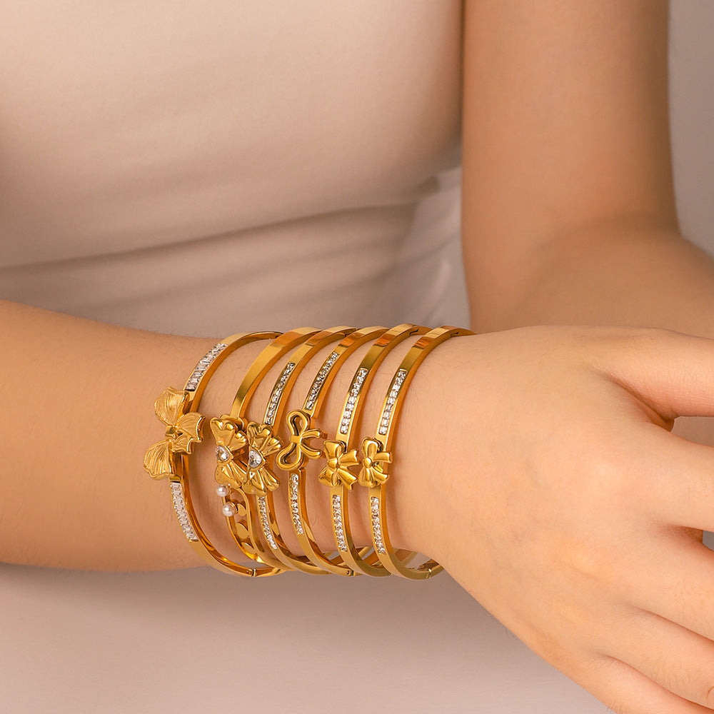 Asymmetrical Bow-Shaped Stainless Steel Bracelet for Women with Zircon Inlay and 18K Gold Plating