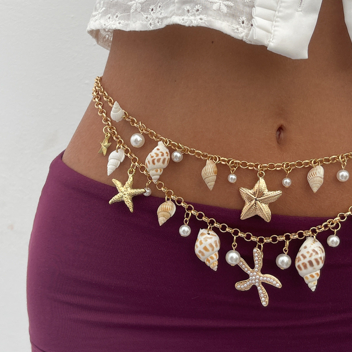 Cinturón de cadena metálica con forma de estrella de mar minimalista para mujer, con detalles de perlas de imitación y cierre de mosquetón
