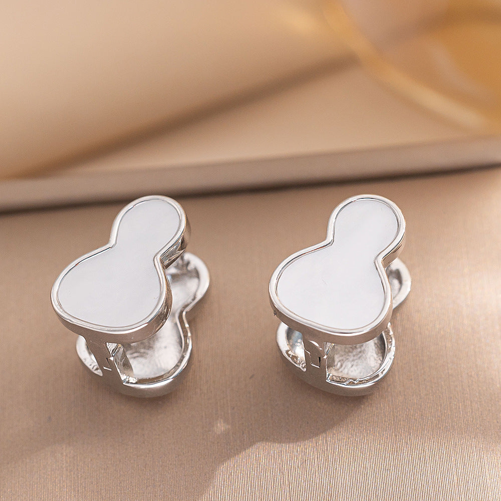 Orecchini a perno Saturno minimalisti color oro in ottone con zirconi per donna