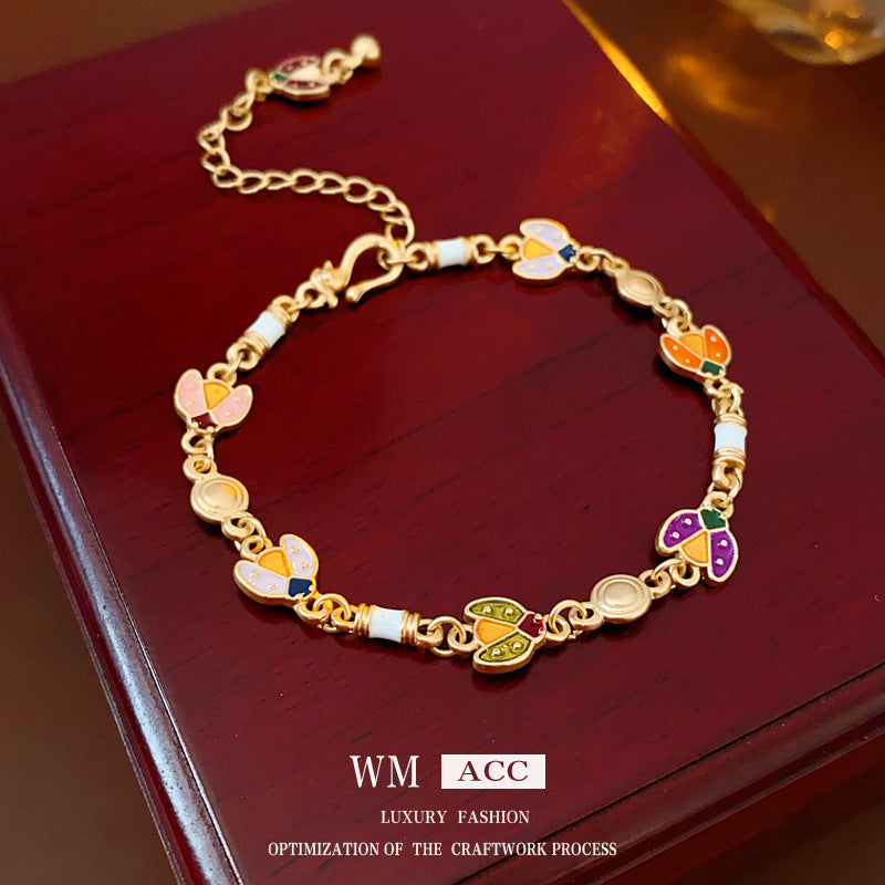Bracciale vintage da donna con motivo floreale geometrico in lega e smalto, elegante gioiello di lusso
