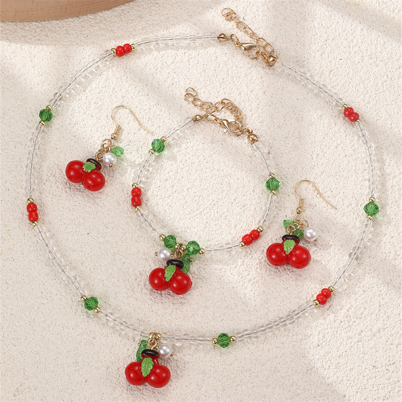 Set collana e braccialetto in lega con fiocco minimalista per ragazze con ciondoli a forma di ciliegia, uva, frutta e stella marina