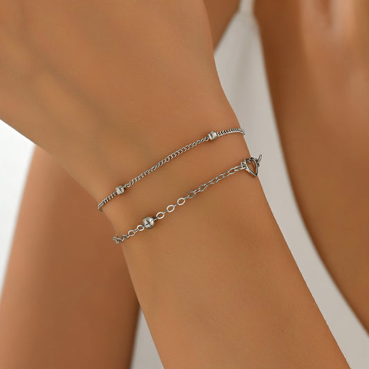 Bracciale da donna placcato rame con cuore geometrico minimalista e forma a diamante, con elegante design a doppio strato