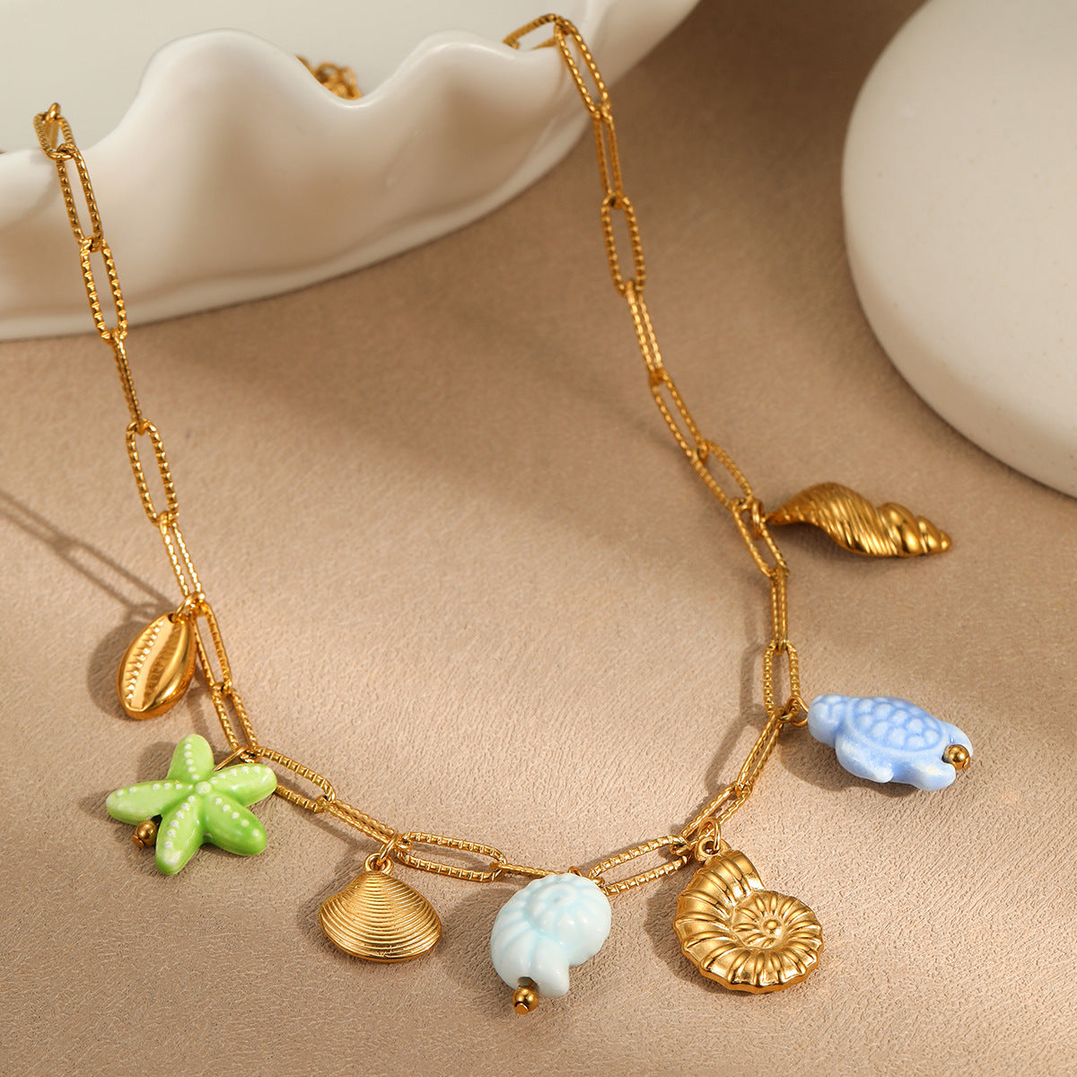 Minimalist Ocean-Inspired Tassel Multi-Pendant Necklace with Starfish and Shell Charms in Stainless Steel with Plated Finish