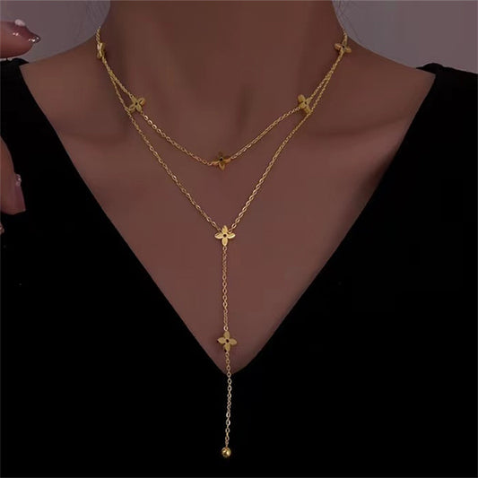 Collar con colgante en forma de L de doble capa chapado en acero de titanio geométrico estilo dibujo animado con borla y diseño de clavícula cruzada para mujer