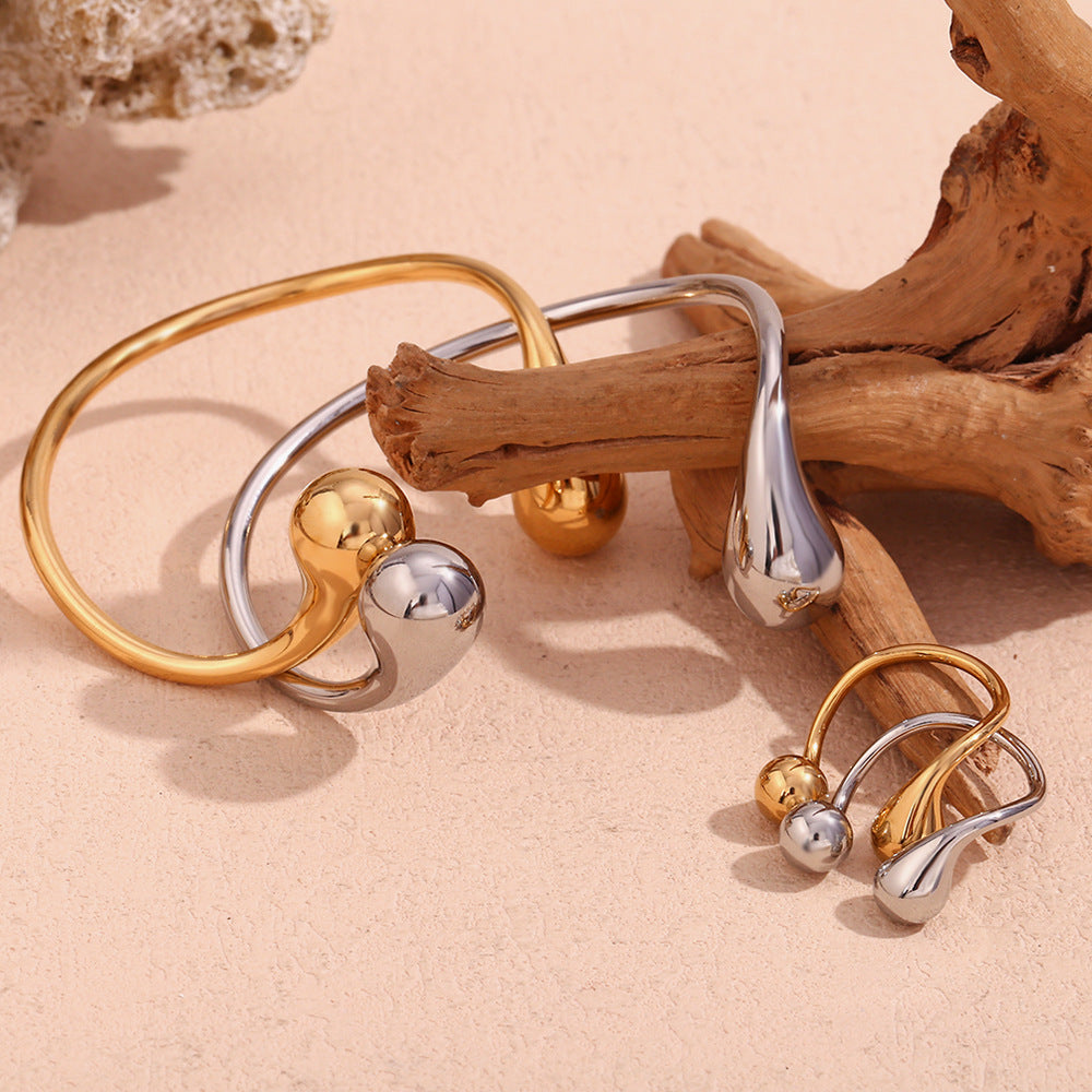 Bracciale rigido aperto minimalista da donna in acciaio inossidabile placcato oro 18 carati con doppia goccia irregolare