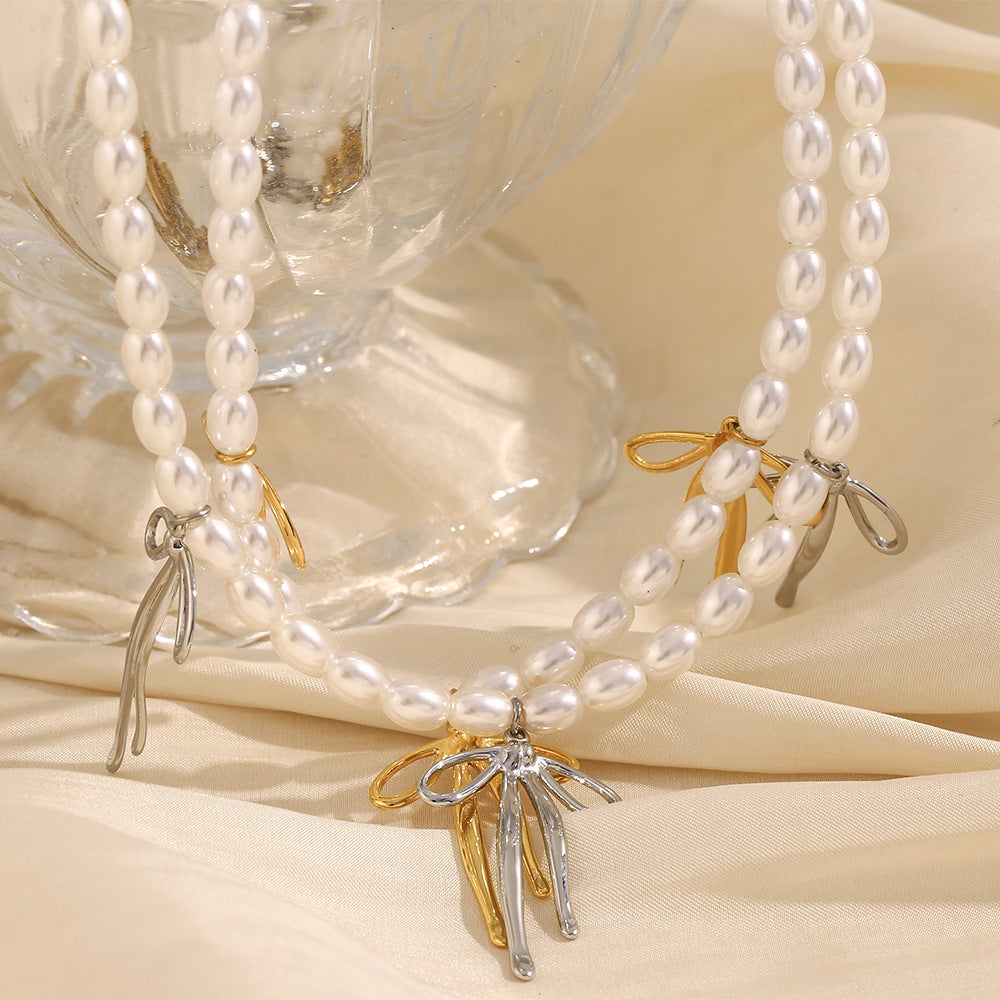 Fashionable Bowknot Pendant Necklace for Women in Stainless Steel with 18K Gold Plating and Imitation Pearl Accent