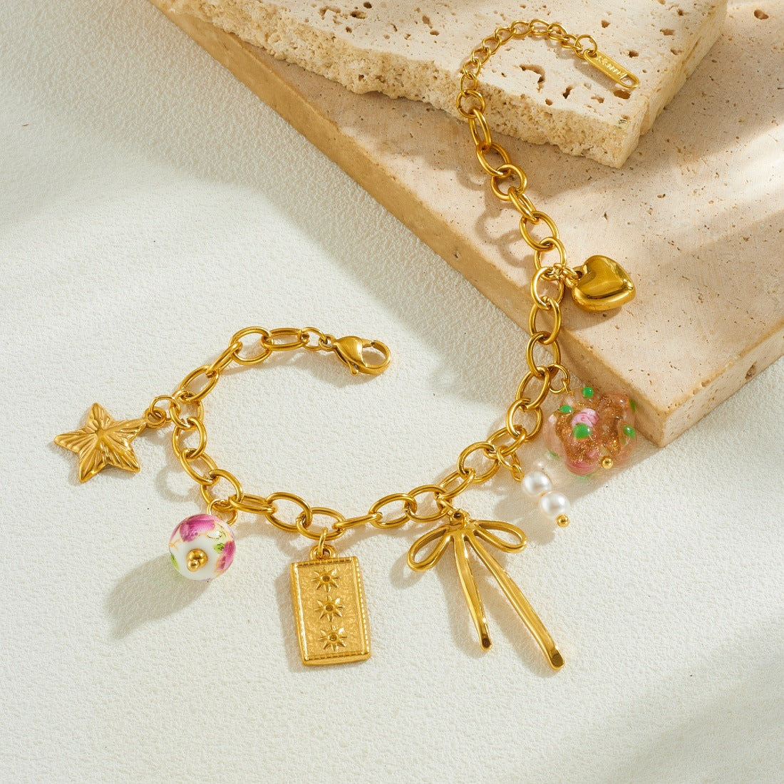 Sweet Gold Plated Stainless Steel Bracelet with Bow and Star Ceramic Charms