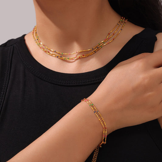 Conjunto de collar y pulsera minimalistas elegantes de acero inoxidable bañados en oro de 18 quilates con cuentas redondas geométricas de acero de titanio