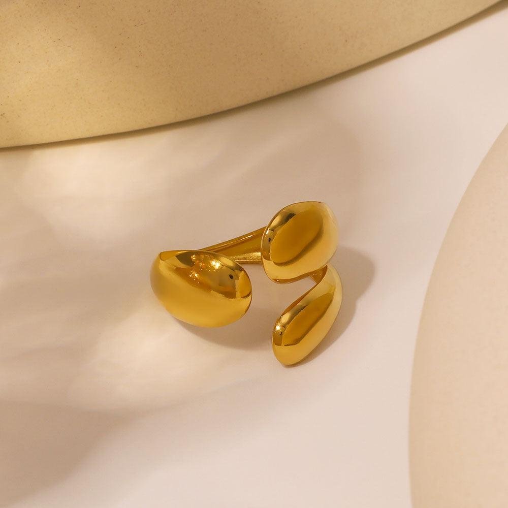Anello in acciaio inossidabile placcato oro con motivo a foglia, ovale asimmetrico geometrico intagliato e traforato