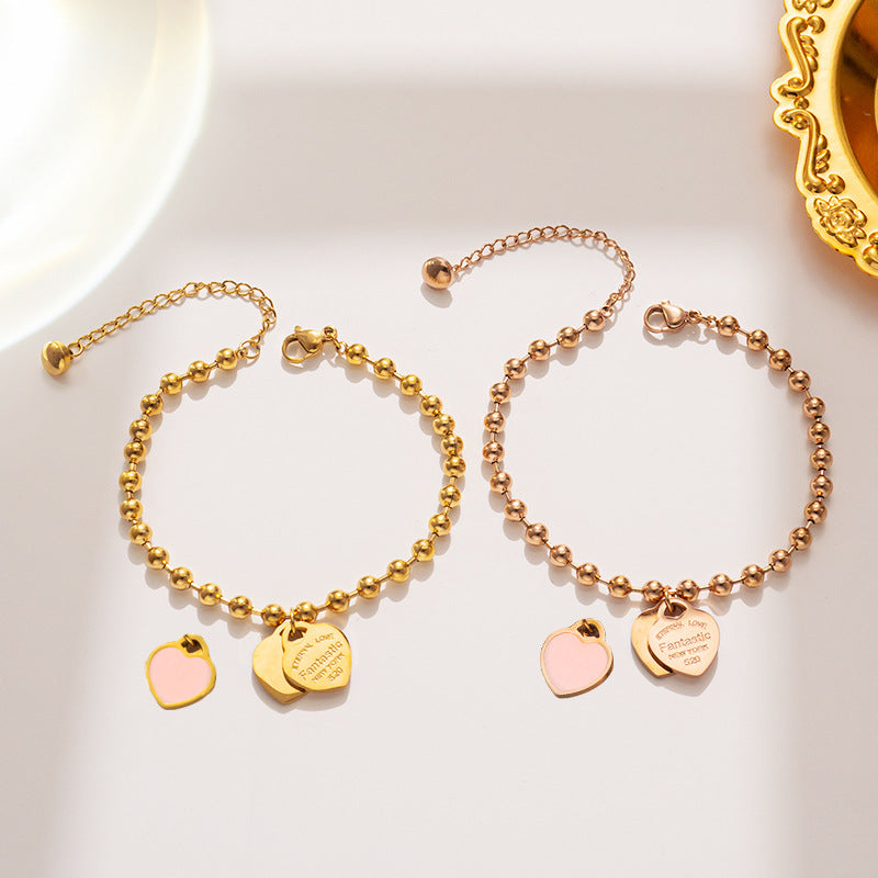 Bracciale minimalista da donna in acciaio al titanio a forma di cuore con finitura placcata