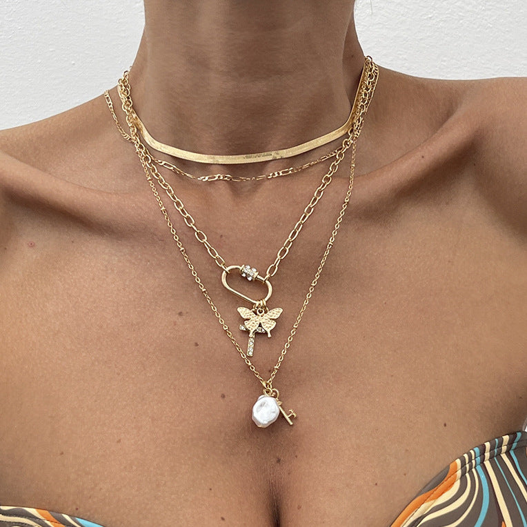 Collana con ciondolo a stella e fiore in stile vacanza per donna con perla finta, lega, finitura placcata, nappa e design geometrico su catena di perle