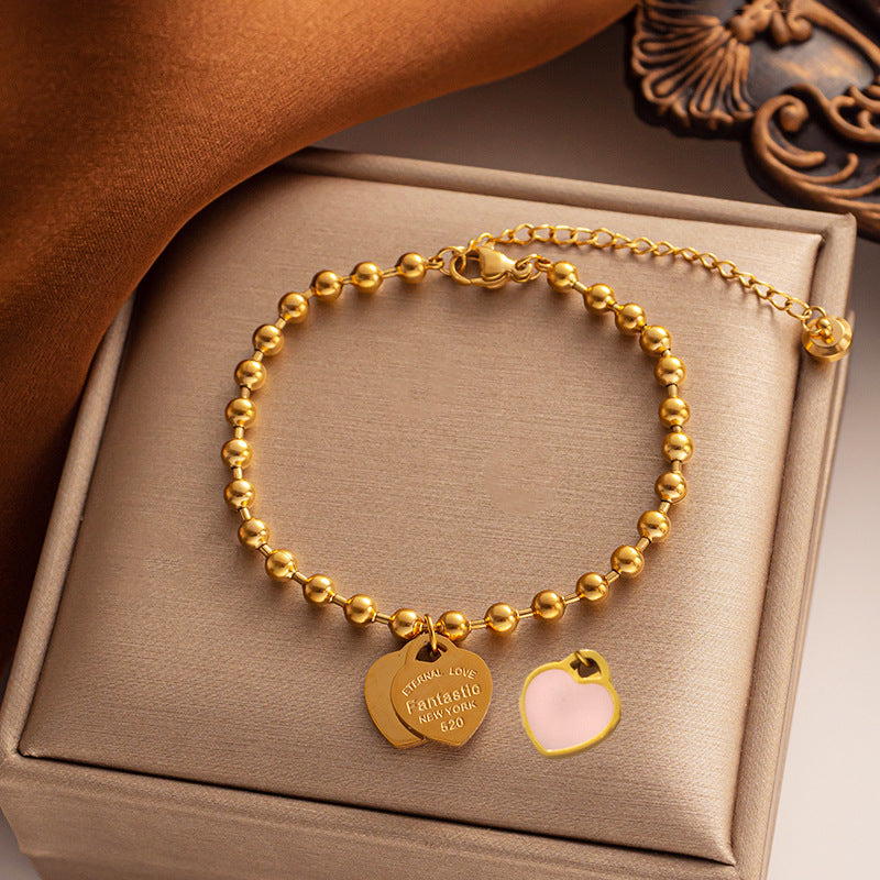 Bracciale minimalista da donna in acciaio al titanio a forma di cuore con finitura placcata