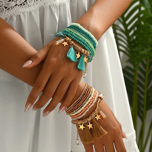 Bracciale donna multistrato bohémien con perline geometriche, nappa e ciondolo a stella
