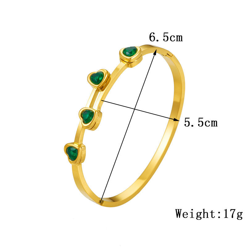 Elegante pulsera de titanio chapado en oro con circonitas en forma de corazón para mujer