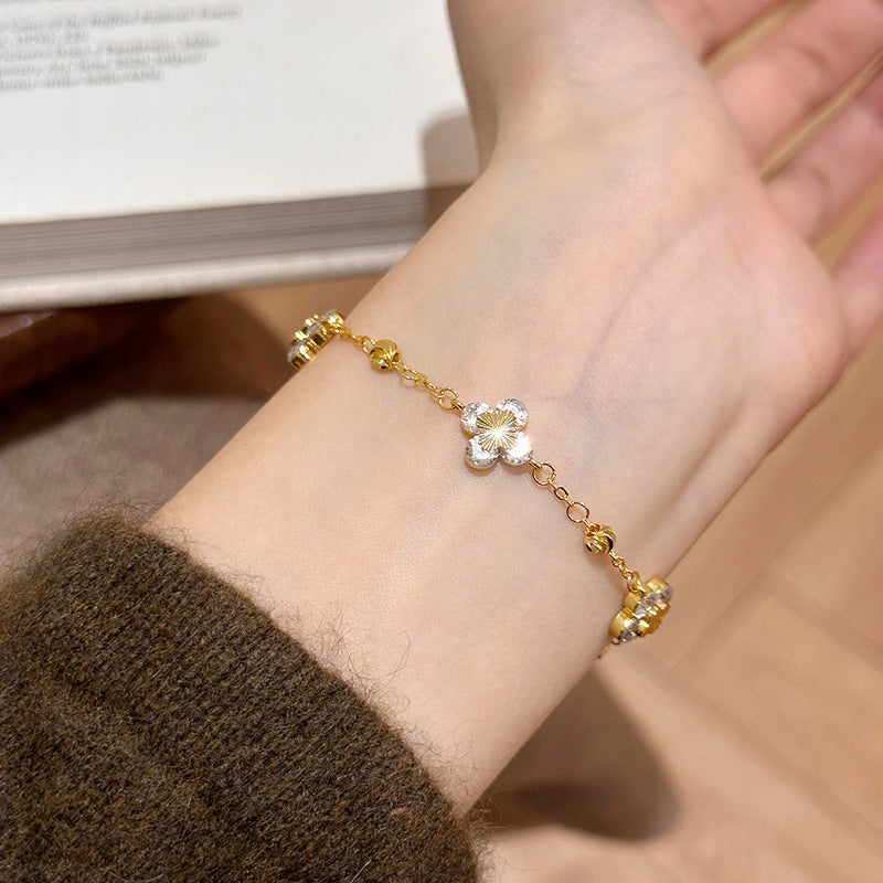 Elegante bracciale da donna regolabile in rame con zirconi a forma di fiore e stile minimalista di lusso