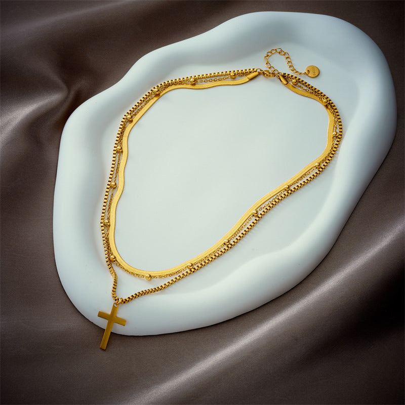 Collar minimalista con colgante de cruz multicapa en acero de titanio con acabado chapado para mujer
