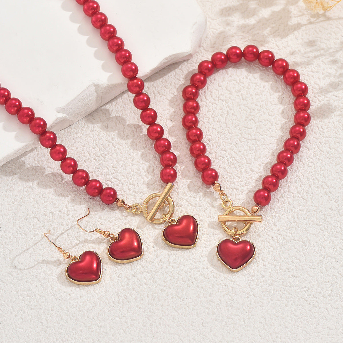 Conjunto de collar, pendientes y pulsera de aleación con perlas de corazón geométrico para mujer