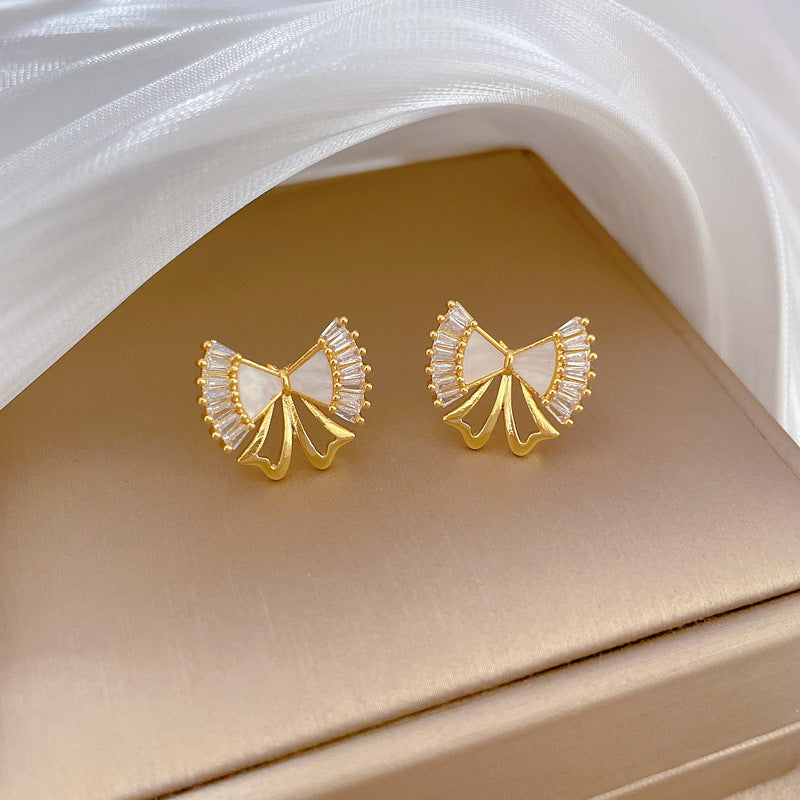 Elegante conjunto de collar y pendientes de acero de titanio con lazo y acabado chapado para mujer