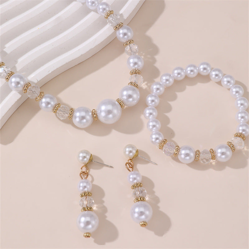 Conjunto de collar, aretes y pulsera minimalistas con perlas y lazo para niñas