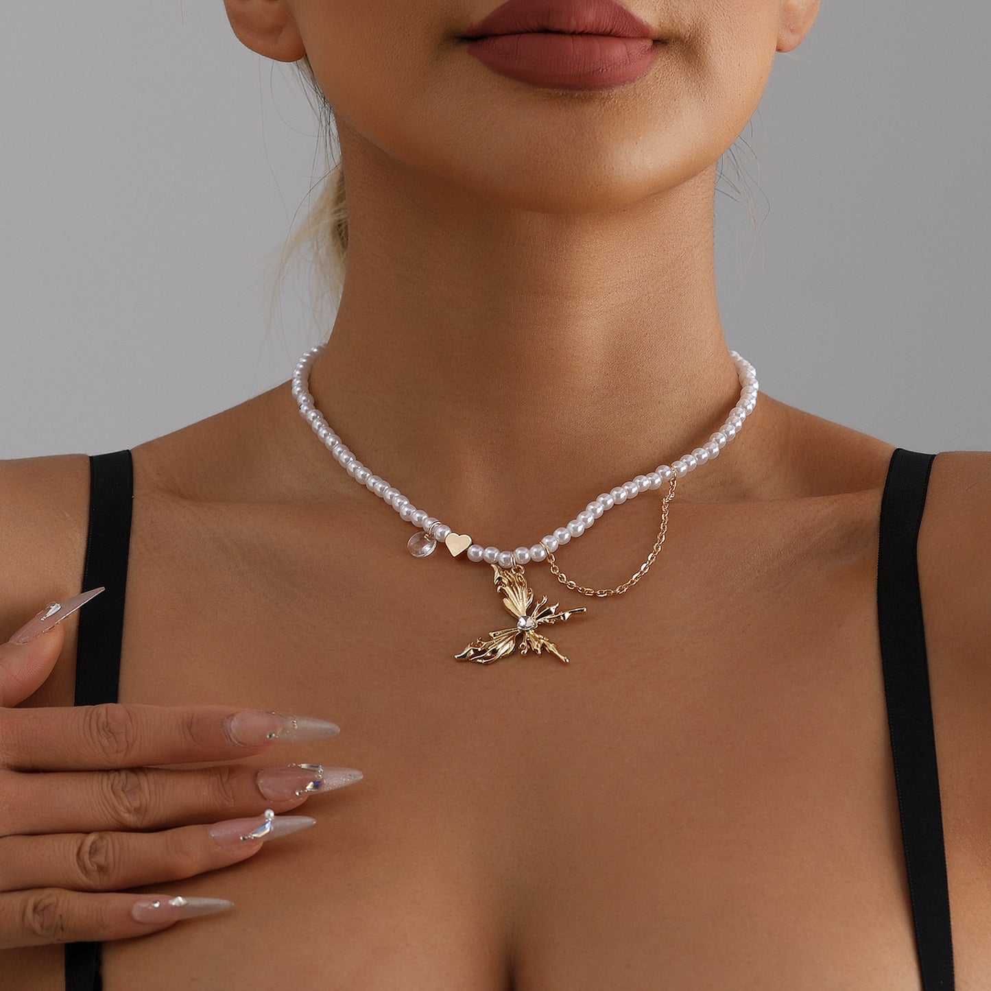 Fashion Butterfly Wing Heart-Shaped Zircon-Inlaid Alloy Pendant Necklace with Pearl Tassels for Women