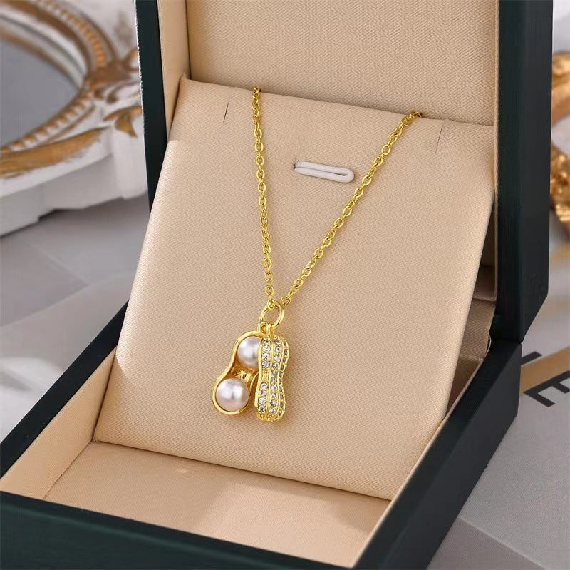 Collar con colgante minimalista de acero de titanio con forma de cacahuete y circonitas para mujer
