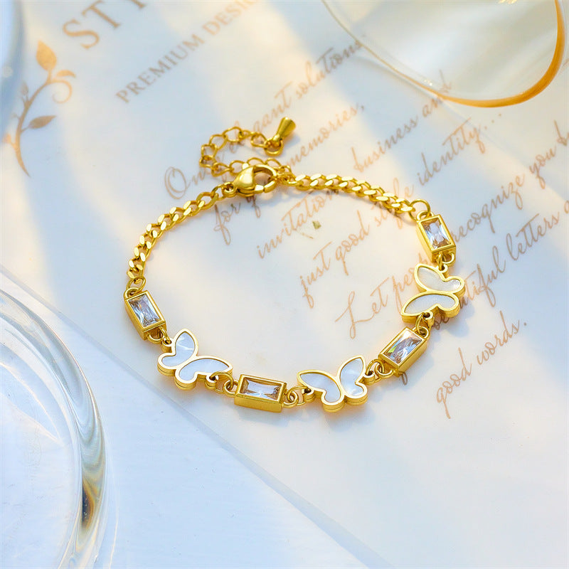 Pulsera minimalista de acero de titanio con forma de mariposa, incrustaciones de pedrería y acabado chapado para mujer