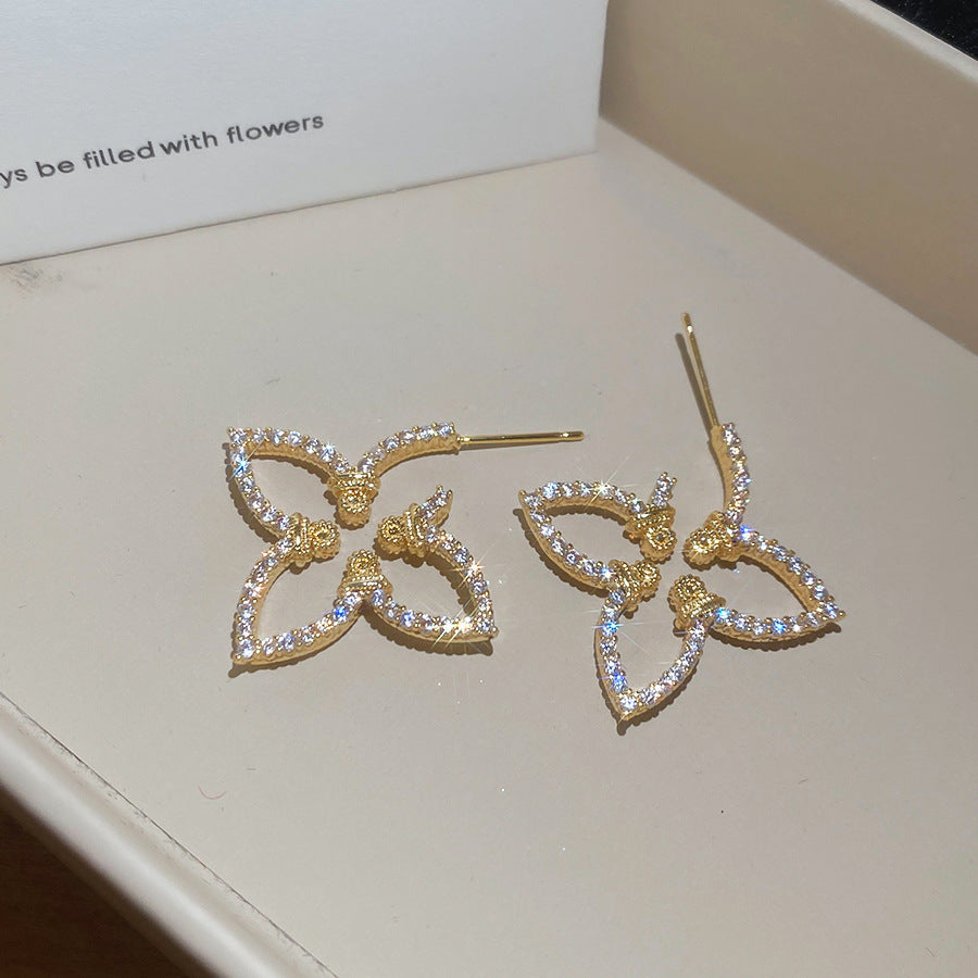 Pendientes florales minimalistas con incrustaciones de circonita en postes de acero inoxidable para mujer