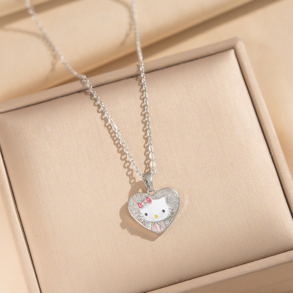 Collana con ciondolo dolce e carino a forma di gattino in acciaio al titanio placcato oro, con fiocco e design a fumetto, motivo a cuore, catena a O per donne