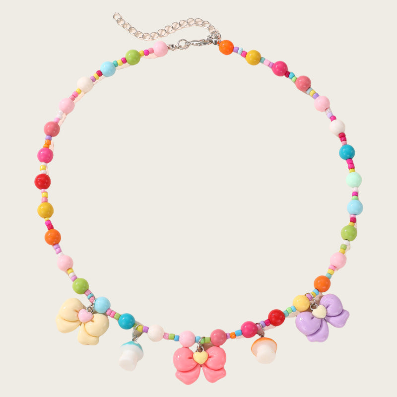 Collana con ciondolo a fiocco dolce pastello per ragazze con ciondolo in resina su catena a O, gioielli in stile cartone animato
