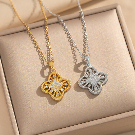 Collana con ciondolo a quadrifoglio geometrico vuoto di lusso in acciaio inossidabile con intarsio in zircone e placcatura in oro 18 carati da donna