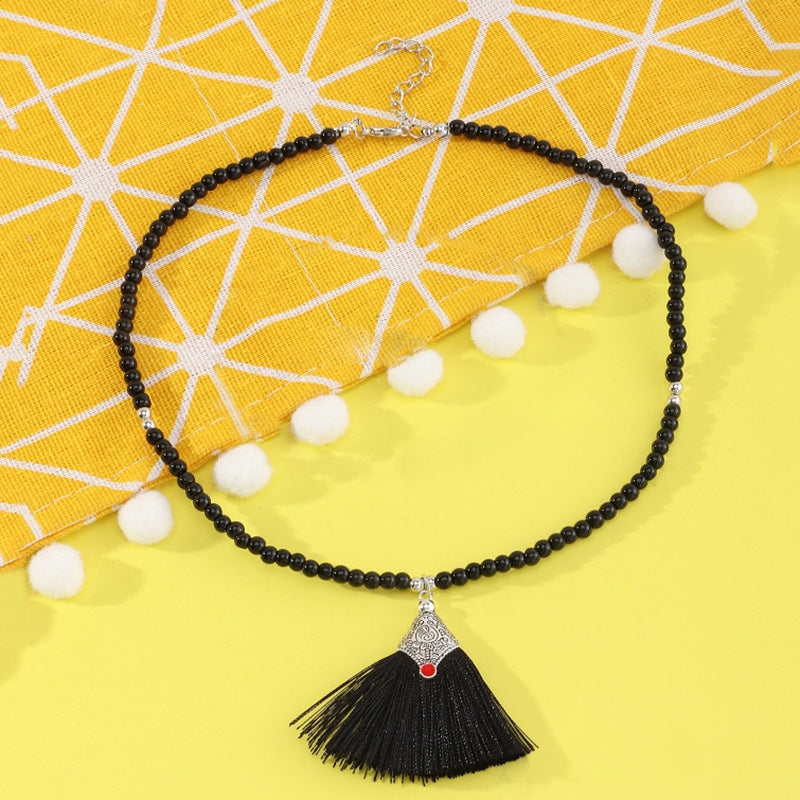 Collana pendente con nappe in stile bohémien per bambini, realizzata in perline di vetro con nappe abbinate su catena di perline rotonde