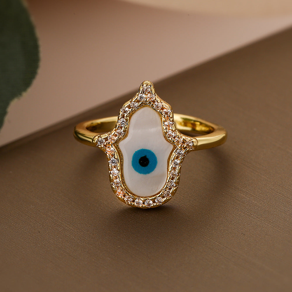 Anello da donna minimalista geometrico in rame placcato oro con micro-pavé di zirconi a forma di occhio turco