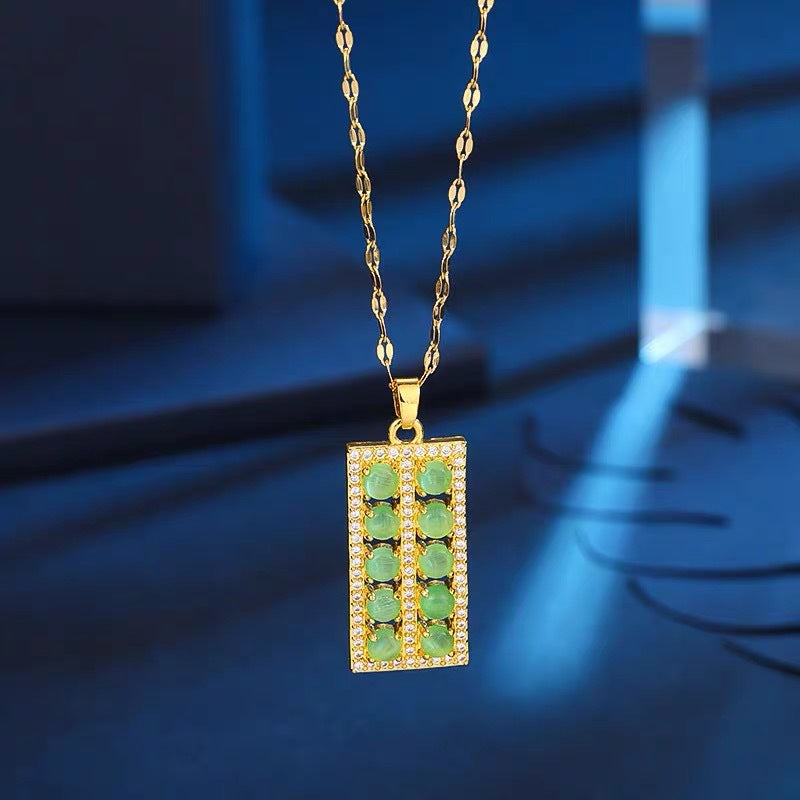 Collana con ciondolo floreale dal design originale per donne e uomini in acciaio al titanio con intarsio in rame placcato oro e catena a O