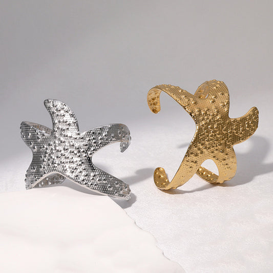 Pulsera minimalista de acero inoxidable con forma de estrella de mar para mujer con baño de oro de 18K y sensación de acero de titanio de primera calidad