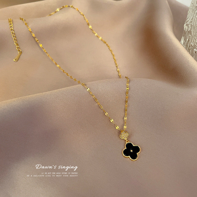 Minimalist Four-Leaf Clover Pendant Necklace in Titanium Steel with Micro-Pavé Zirconia and Fringe Detail