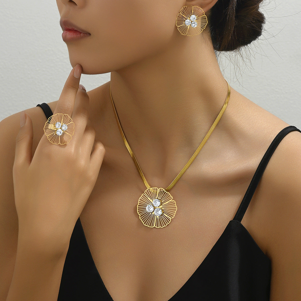 Set di collana e orecchini in rame floreale minimalista con zirconi intarsiati da donna