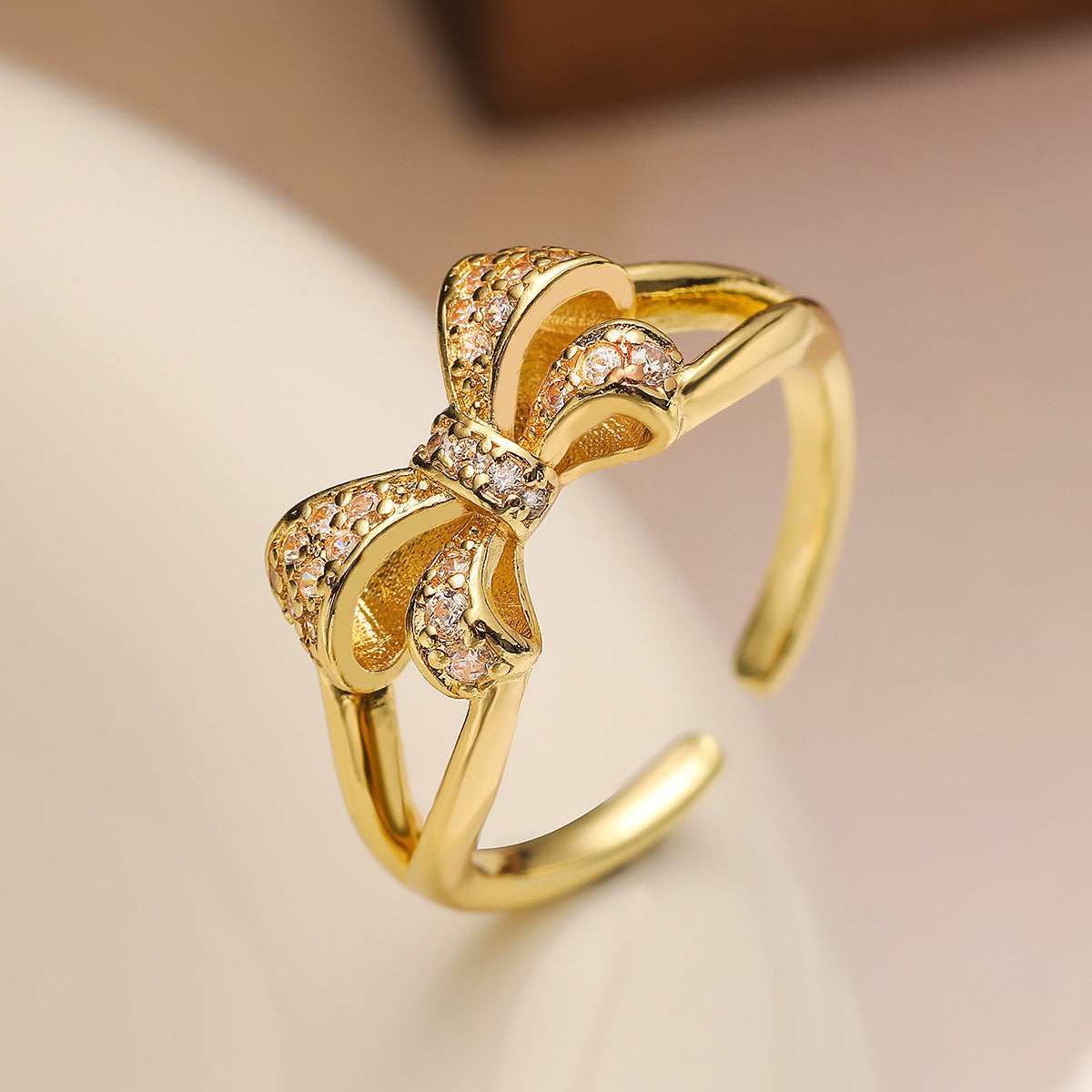 Sweet Style Geometric Bowknot Ring for Women Made of Brass with Real Gold Plating and Micro-Paved Zirconia